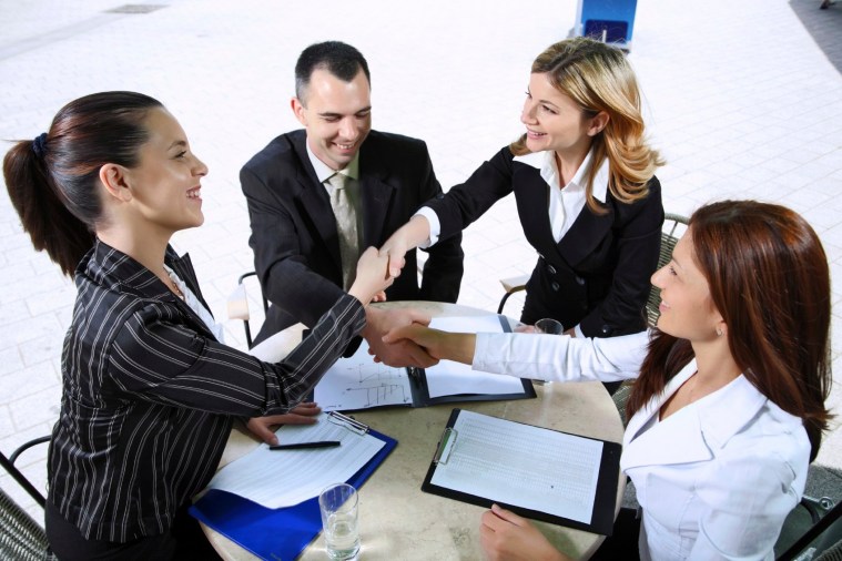 Businesspeople shaking hands.